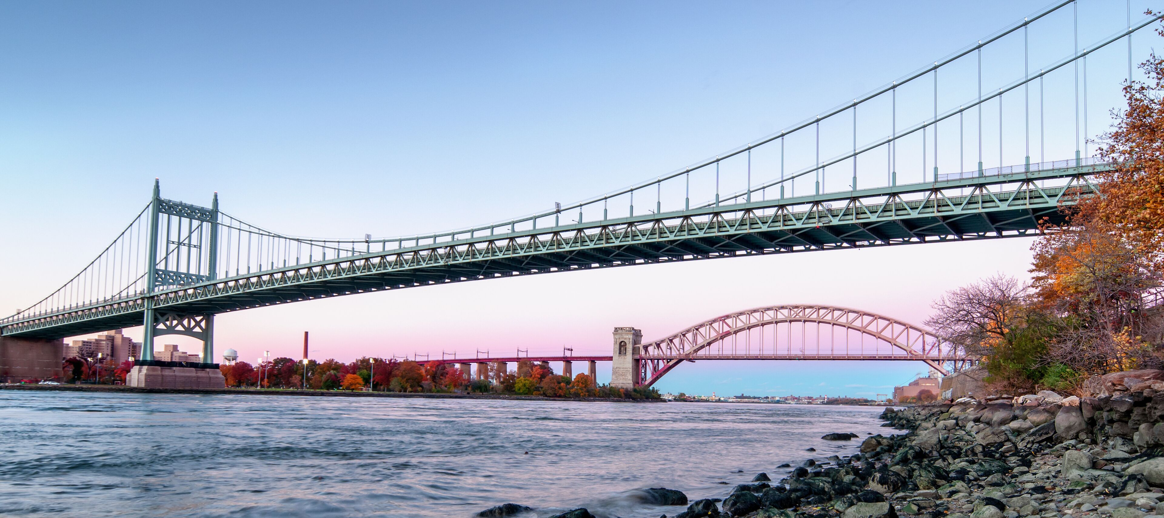 Hell Gate Bridge and Triborough Bridge at night, in Astoria, Queens, New York. USA