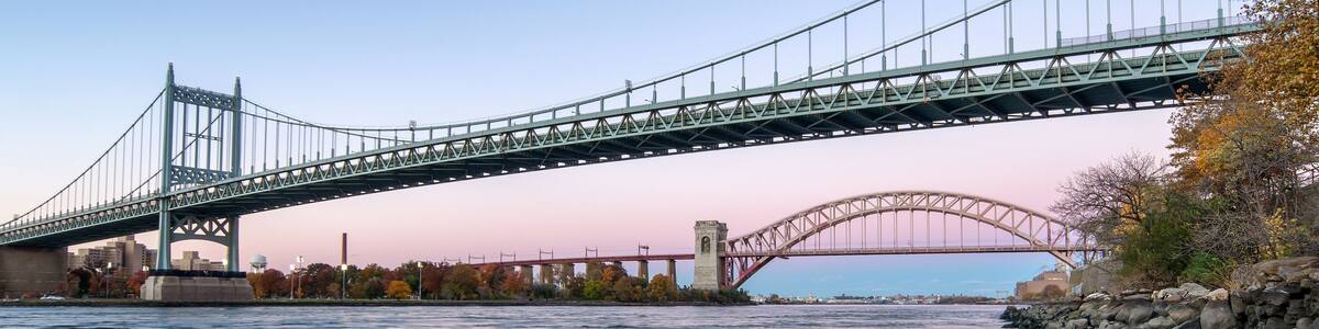 Hell Gate Bridge and Triborough Bridge at night, in Astoria, Queens, New York. USA