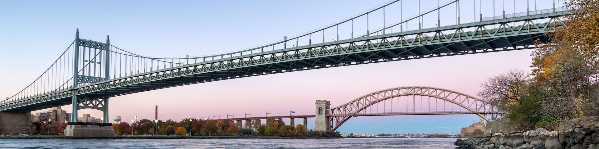 Hell Gate Bridge and Triborough Bridge at night, in Astoria, Queens, New York. USA