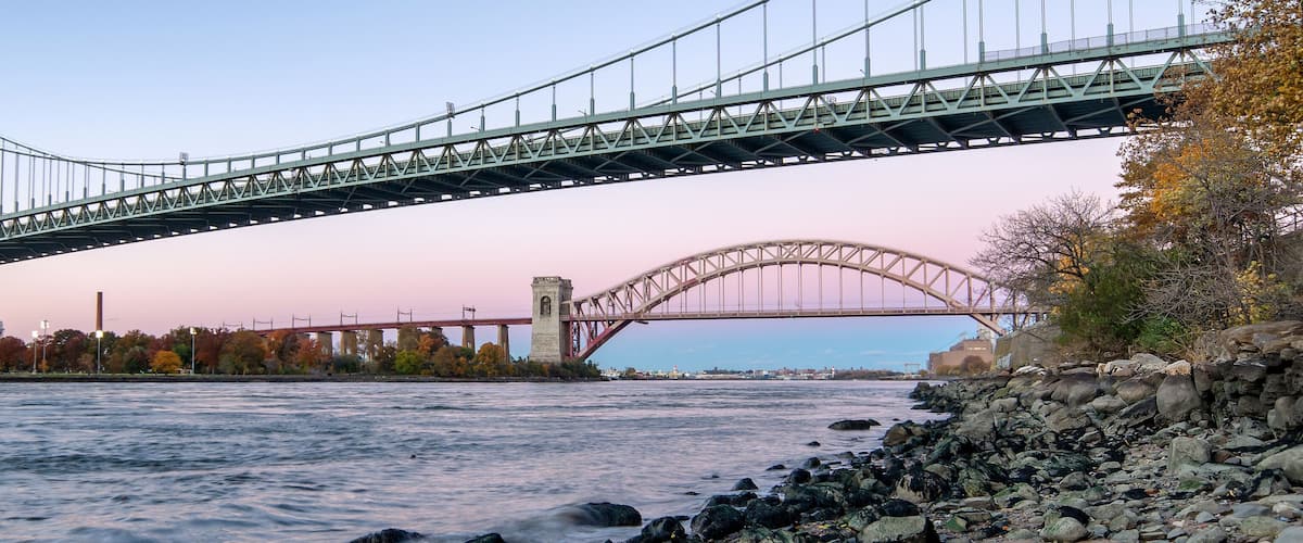 Hell Gate Bridge and Triborough Bridge at night, in Astoria, Queens, New York. USA