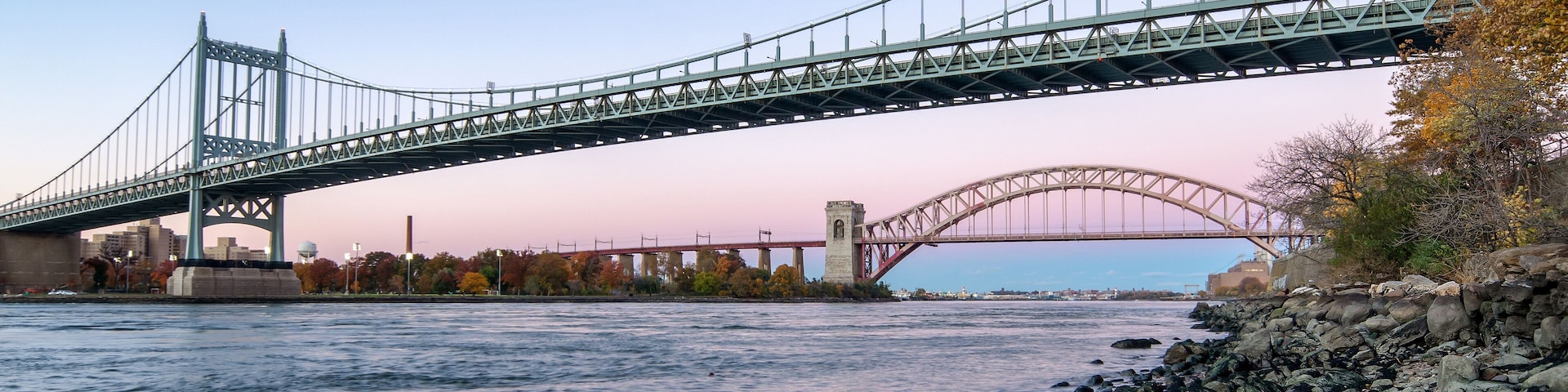 Hell Gate Bridge and Triborough Bridge at night, in Astoria, Queens, New York. USA