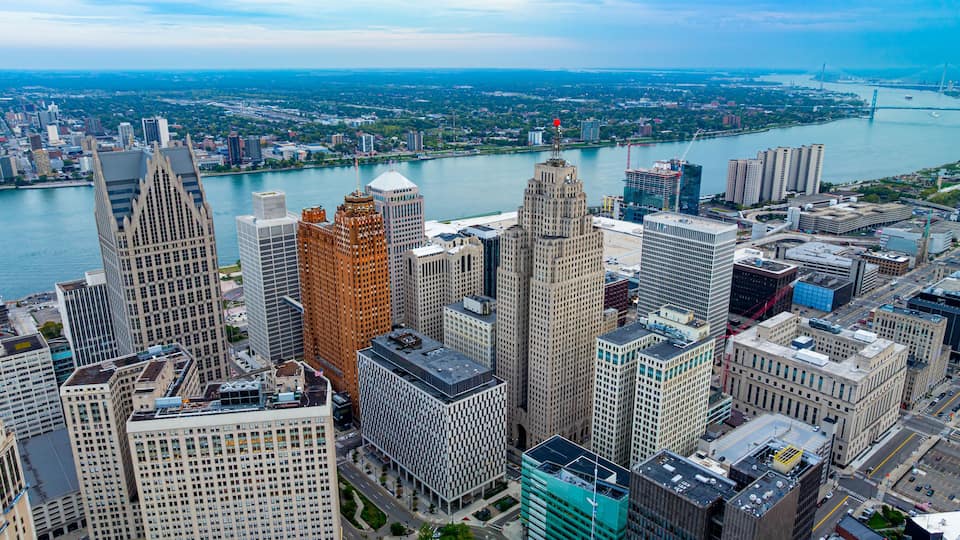 Downtown Detroit aerial view with riverfront buildings. Detroit downtown with the Detroit River and modern skyscrapers.