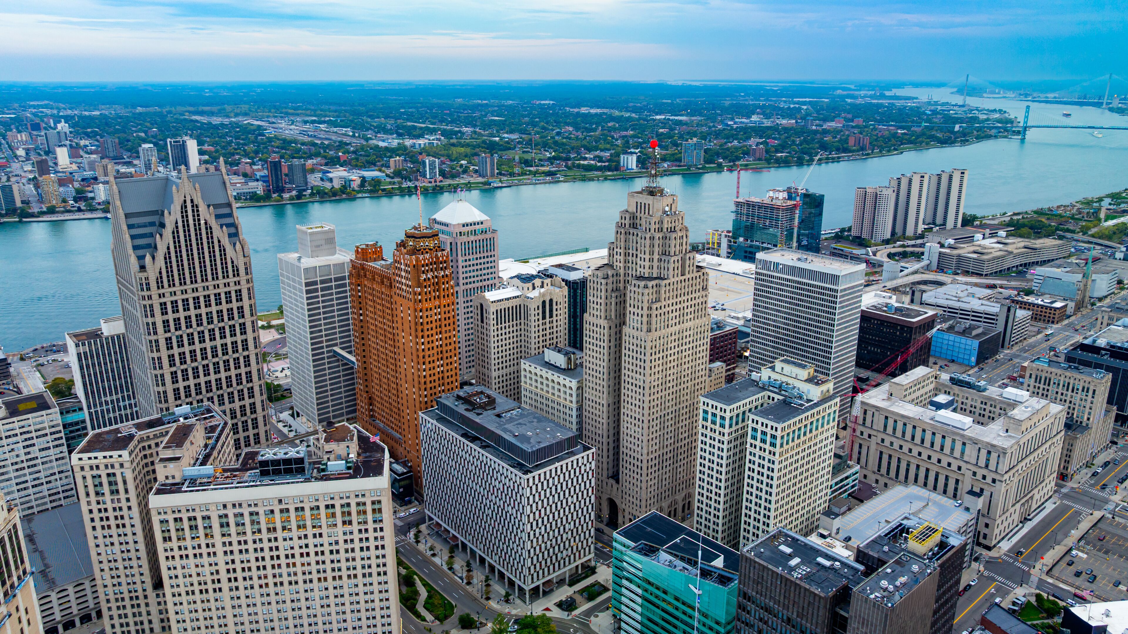 Downtown Detroit aerial view with riverfront buildings. Detroit downtown with the Detroit River and modern skyscrapers.