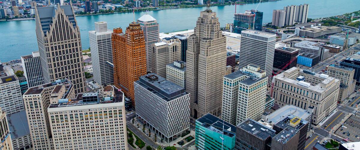 Downtown Detroit aerial view with riverfront buildings. Detroit downtown with the Detroit River and modern skyscrapers.