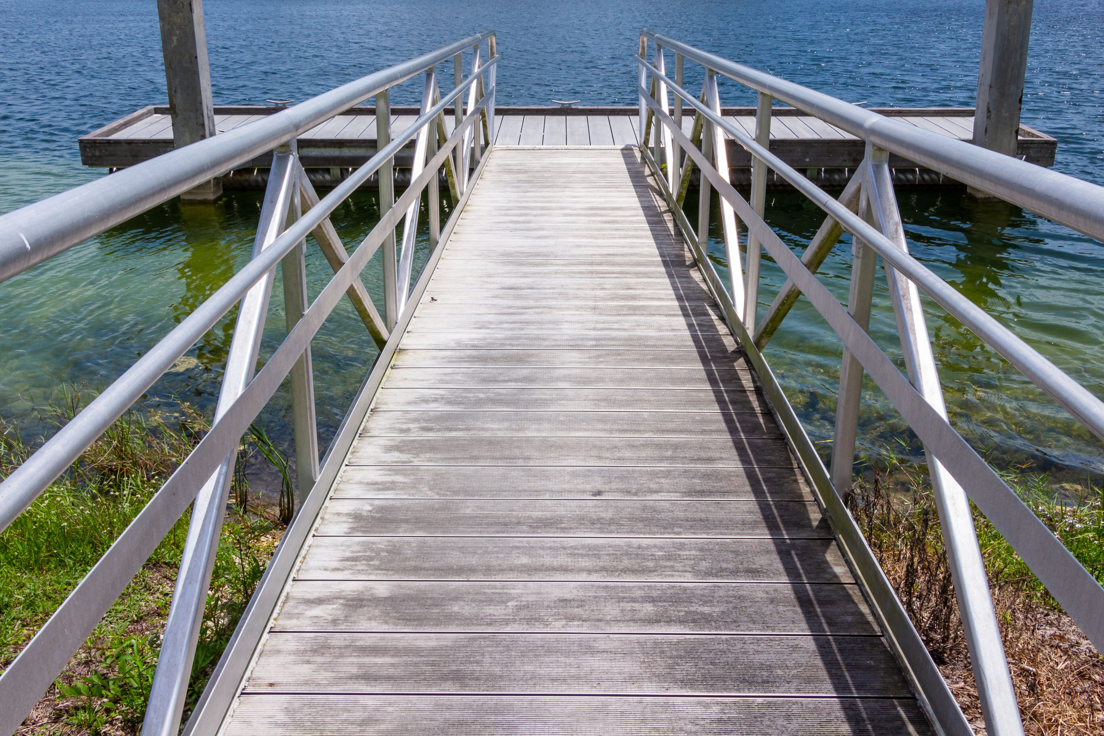 Ramp to boat dock on blue green lake - Vista View Park, Davie, Florida, USA
