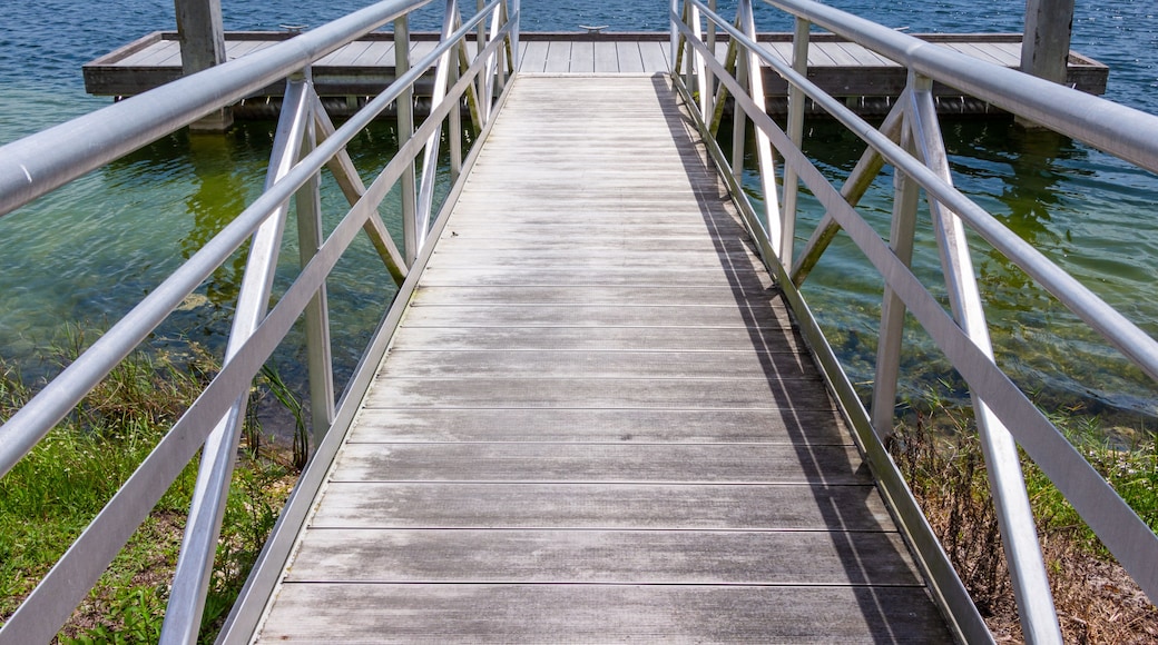 Ramp to boat dock on blue green lake - Vista View Park, Davie, Florida, USA