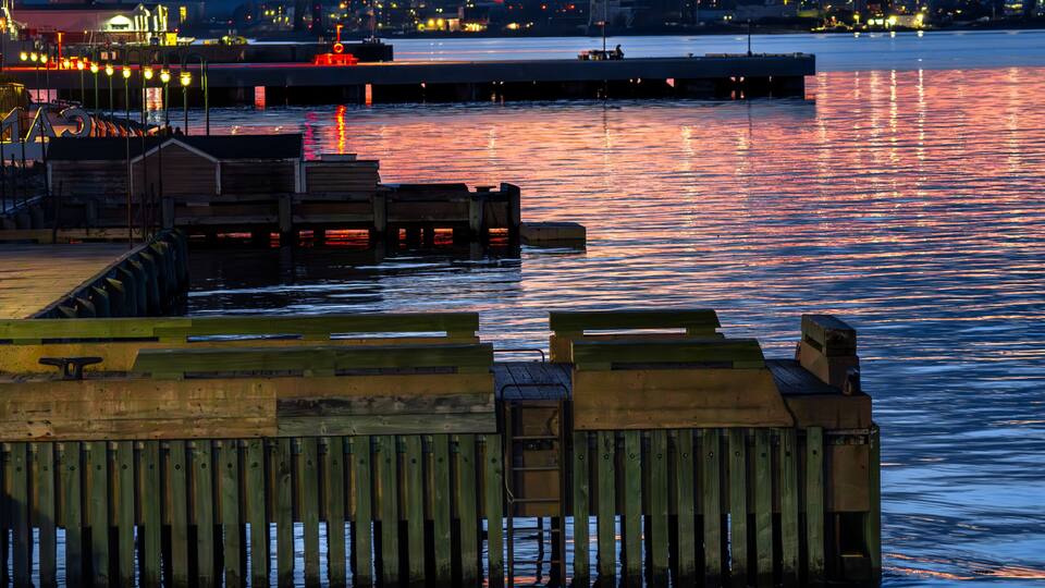 Halifax harbor sunset with Macdonald Bridge and waterfront lights