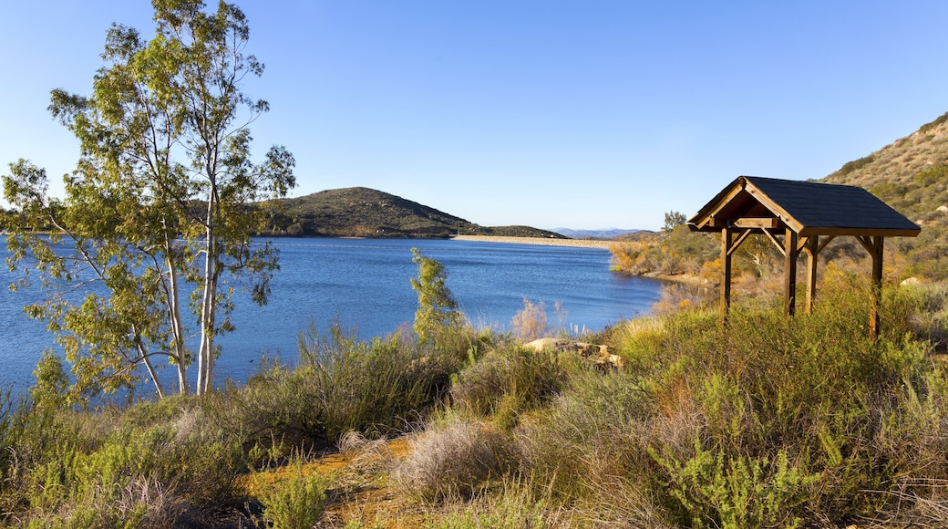 Wooden Gazebo Structure and Picnic Area at Lake Poway Hiking Trail. Scenic San Diego North County Inland Landscape with Blue Sky and Green Grassland