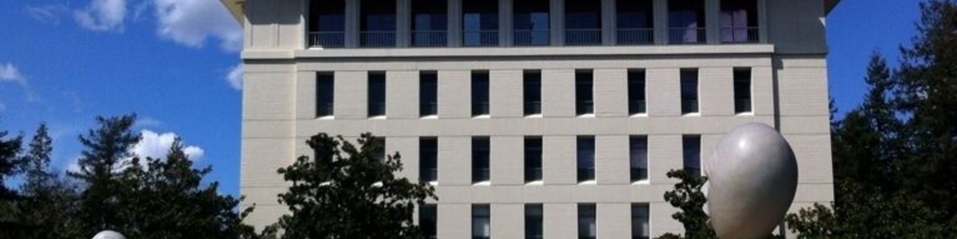 Two Robert Arneson Eggheads at UC Davis. These have mouths, but no ears -- talking, but not listening. They used to be clearly installed in front of the law school, then were moved when the law school expanded. So they are now almost equidistant to the administration building, Mrak Hall. Either way, I believe the irony is true to the artist's intent.