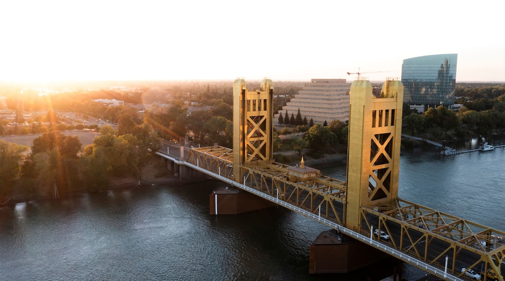 Sunset view of the historic 1935 Tower Bridge and the downtown skyline of Old Sacramento, California, USA.