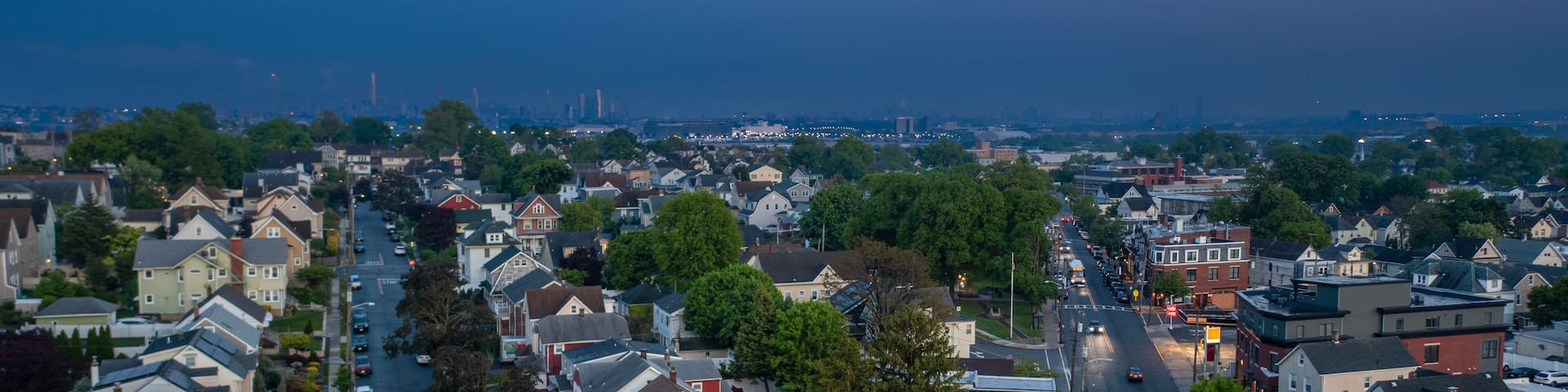 Evening aerial view of East Rutherford New Jersey with Meadowlands and NYC in the distance