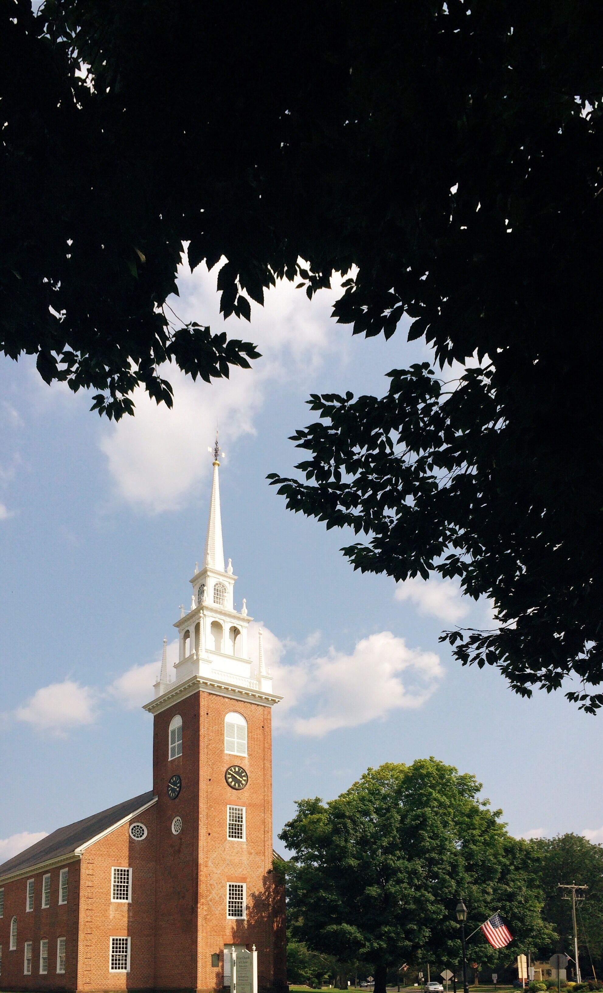 Historic New England Church Framed By Trees