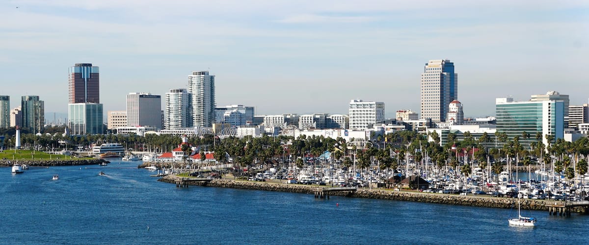 The view of the boat harbor and buildings in the city along Queensway Bay of Long Beach, California, U.S.A