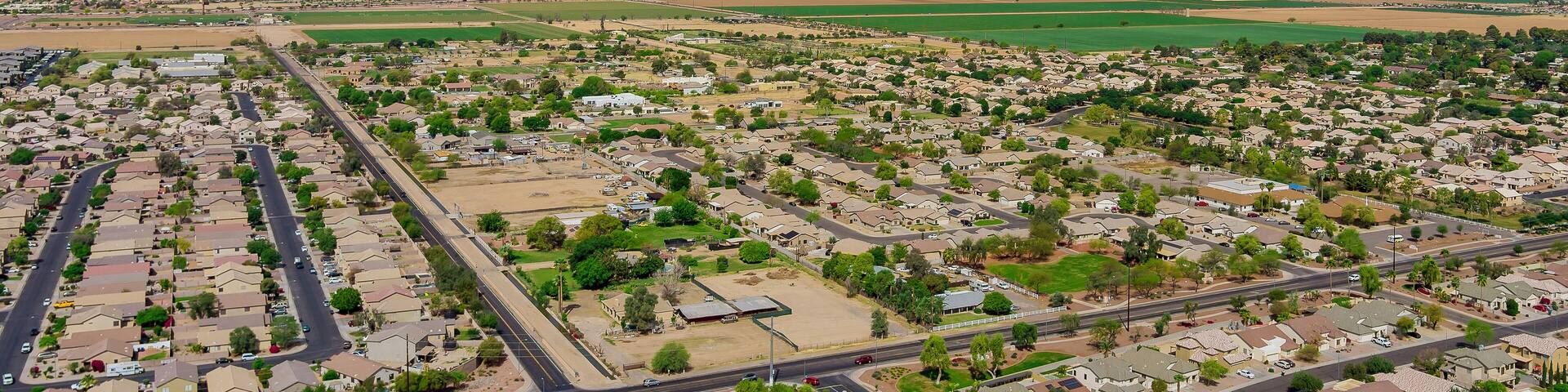 Aerial view of the small town of Avondale in a mountain valley among desert the Arizona