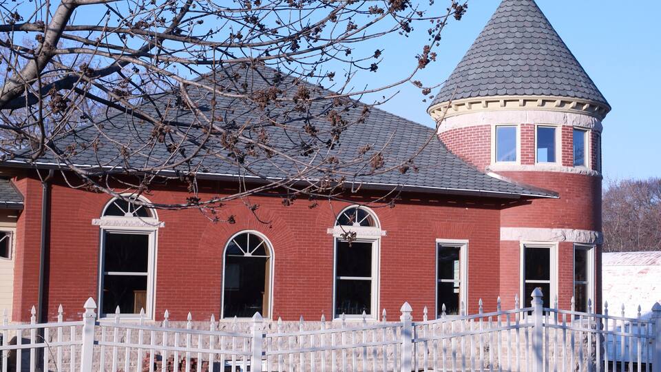 Historic railroad station at the track crossing in Grinnell, Iowa