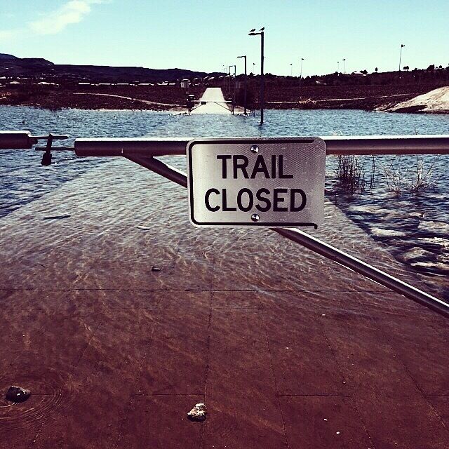 Flooded trail! You shall not pass! Would be fun to run through it though. 