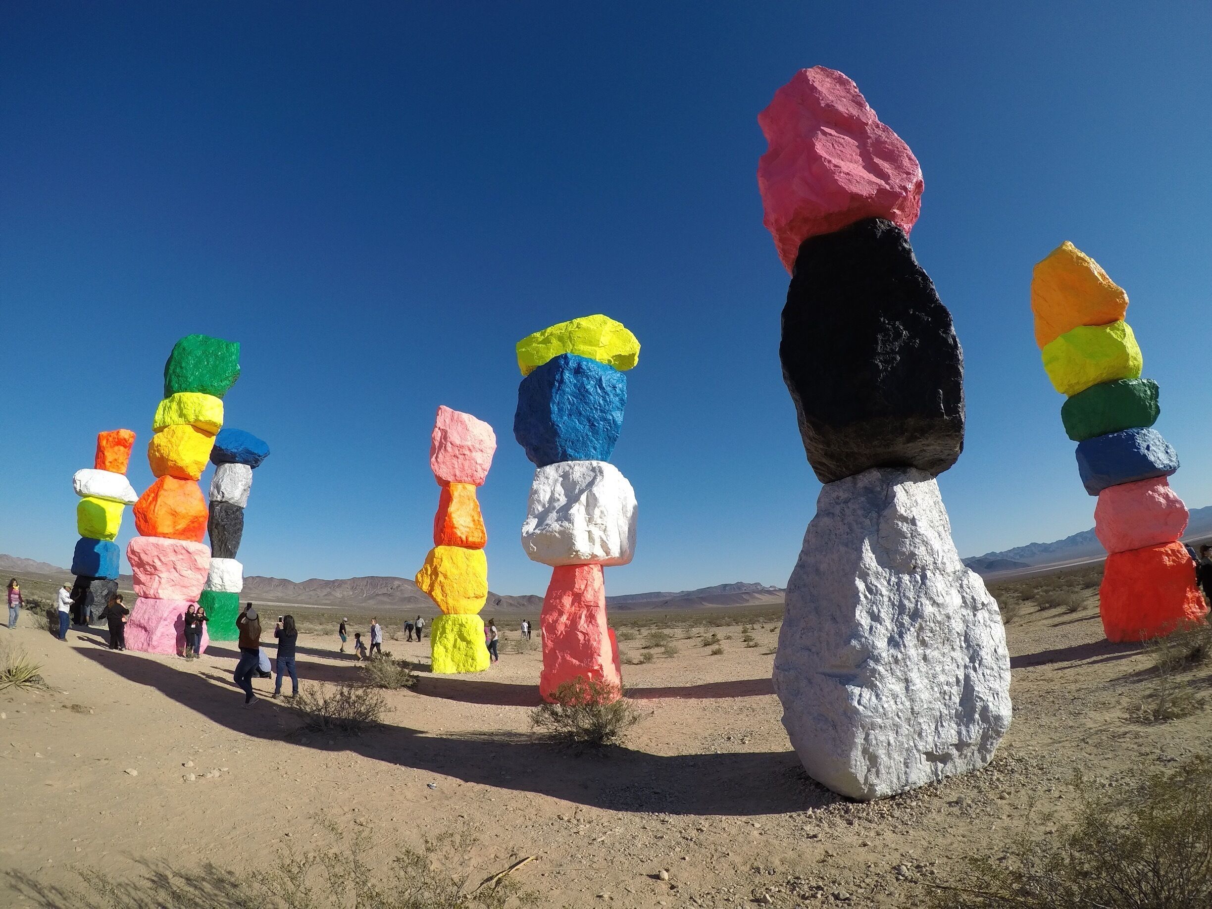 Colorful rock stacks in a desert landscape.