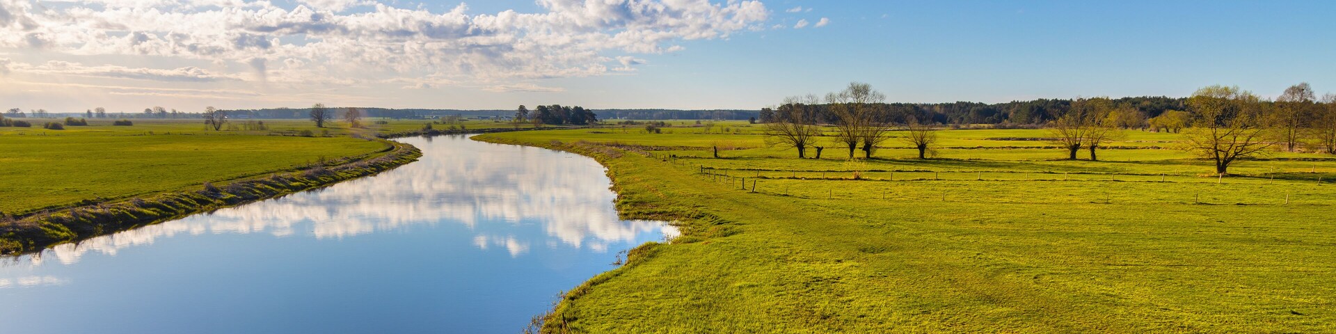 Early spring panoramic view of Narew river valley wetlands and nature reserve seen from Strekowa Gora village near Wizna in Podlaskie voivodship in Poland