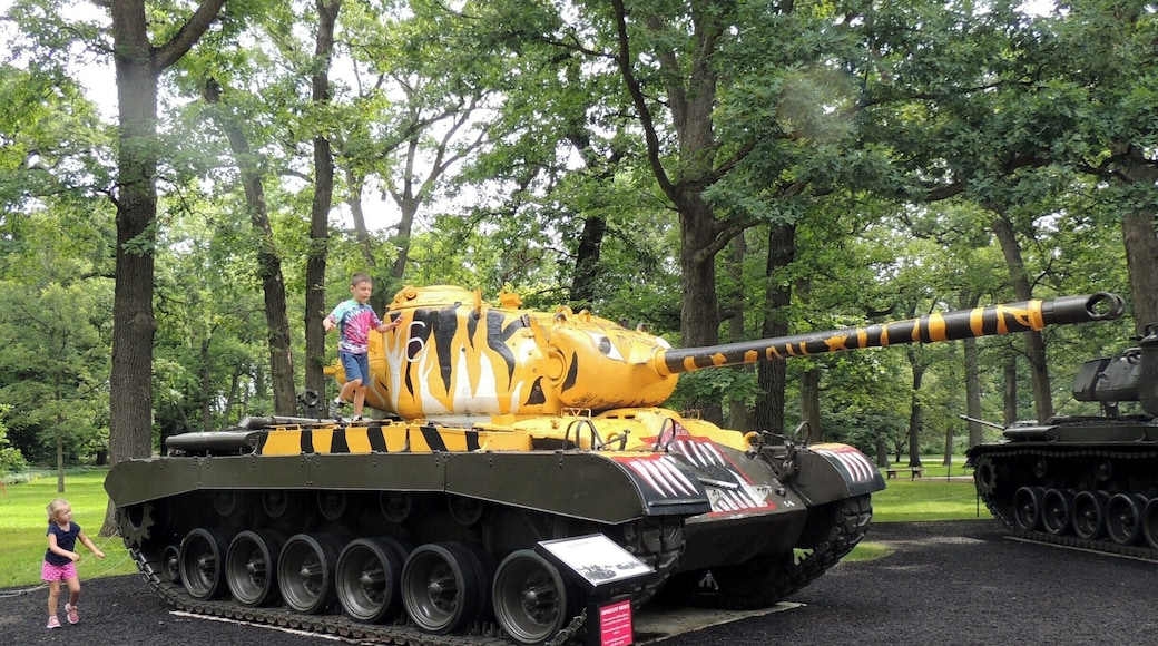 Outside the First Division Museum at Cantigny you'll find almost a dozen tanks on display. The tanks hail from World War I, World War II, the Korean War and the Vietnam War.
This particular tank, the M46 Patton, was designed to fight in the Korean War. It could handle Koreaâs mountainous terrain and pivot through narrow attack routes. The main gun could penetrate the armor of North Koreaâs tanks. It was also deployed as an artillery weapon. This tankâs âTigerâ paint scheme reflects the markings of the 6th Tank Battalion, 24th Division.
Stats: Weight - 48.5 tons; Crew - 5; Main Armament - 90 mm gun; Top speed - 30 mph; Armor Thickness - .5â â 4.5â; Number Produced - 2,015.
A magnet for kids young and old, the place was like an anthill in the middle of a picnic. All are allowed to climb on the tanks, although the day we were there, most of the kids doing the climbing were of the 3' and under variety.
Located just 30 miles west of Chicago, this public park and military museum is a must-see for veterans and those members currently serving in the armed forces.
A $5 parking fee per vehicle will get you into the park with the exception of special events, when additional fees may be incurred.