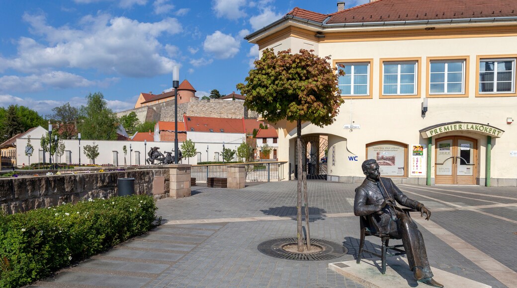 Statue of Geza Gardonyi in Eger, Hungary with the castle of Eger in the background
