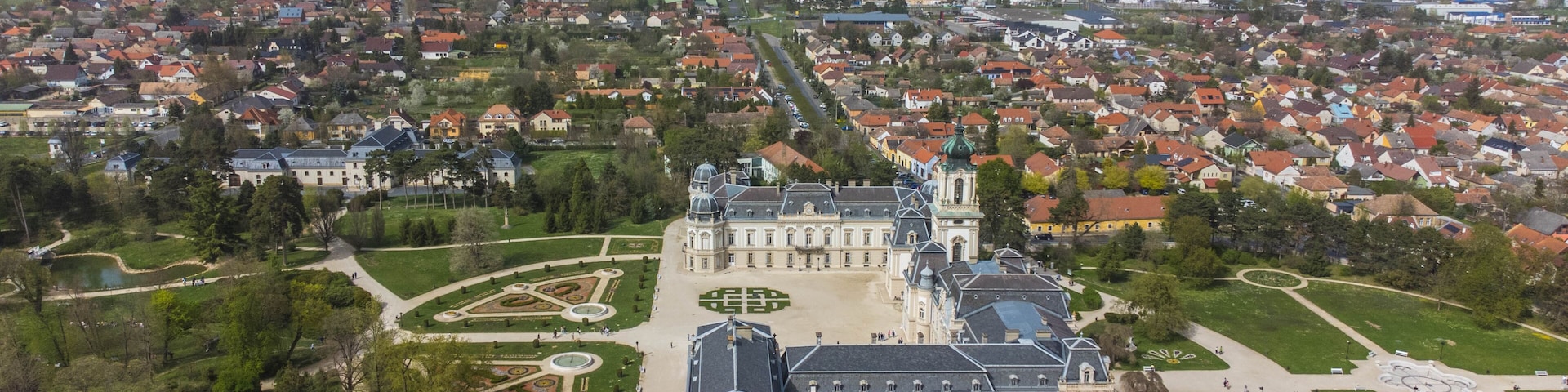 The Keszthelyi Festetics-kastély, or Festetics Palace of Keszthely, is a magnificent Baroque palace located in Keszthely, Hungary, on the shores of Lake Balaton captured from a drone