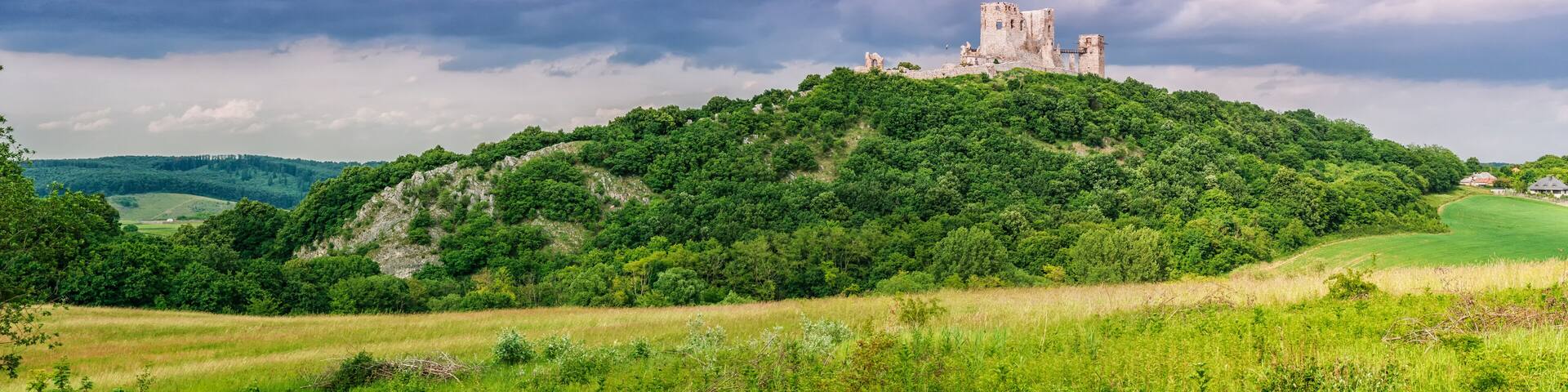 The ruins of the medieval castle of Csesznek sitting on a rock, Western Hungary