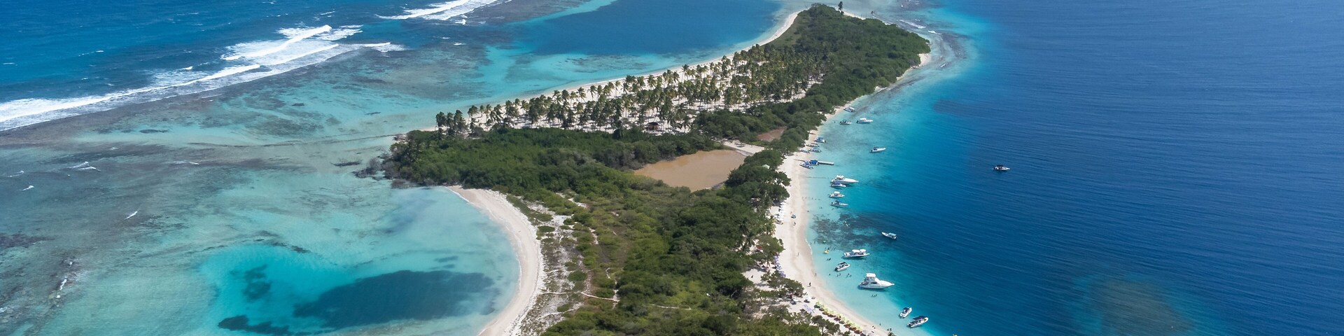Stunning drone view of Morrocoy National Park in Venezuela, showing turquoise waters, coral reefs, sandy beaches, and tropical vegetation. Perfect concept for paradise, travel, and nature