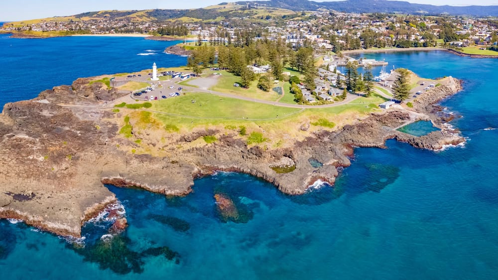 Panoramic aerial drone view at Kiama on the New South Wales South Coast, Australia showing Kiama Lighthouse on a sunny day