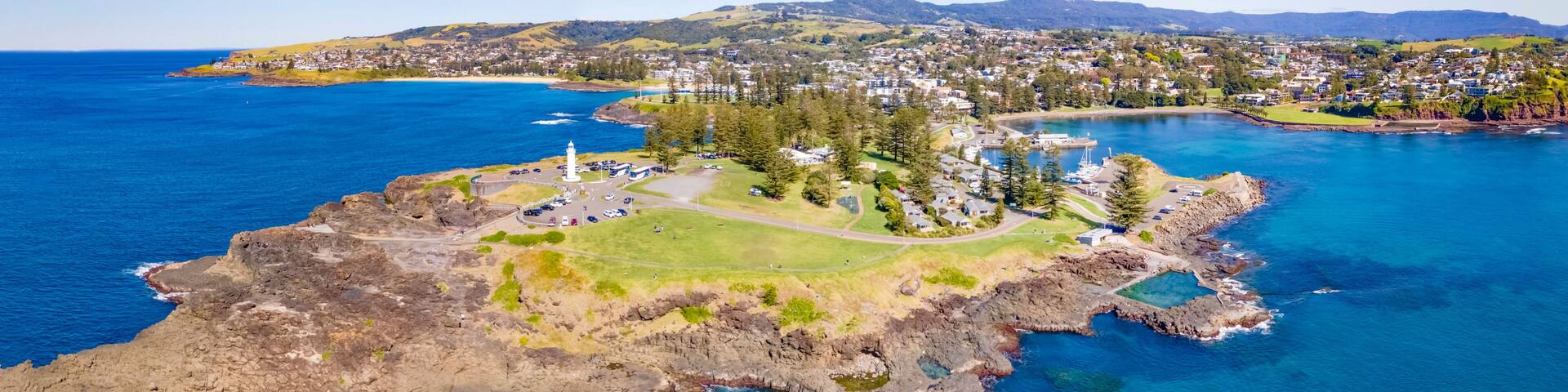 Panoramic aerial drone view at Kiama on the New South Wales South Coast, Australia showing Kiama Lighthouse on a sunny day