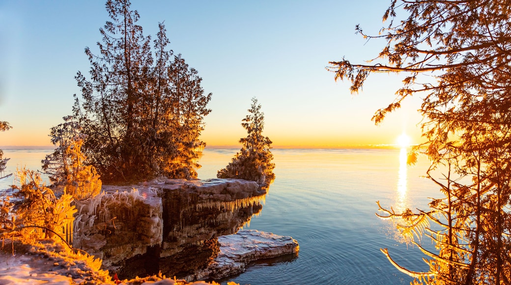 Cold early morning view at Cave Point on the shore of Lake Michigan. Icicles form on everything that gets sprayed with the lake water.