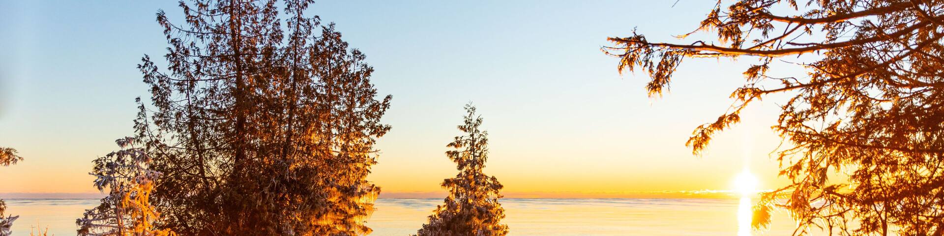 Cold early morning view at Cave Point on the shore of Lake Michigan. Icicles form on everything that gets sprayed with the lake water.