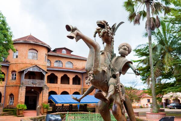 traditional bamileke bronze sculpture of horse in front of royal palace in batoufam in in west region of cameroun