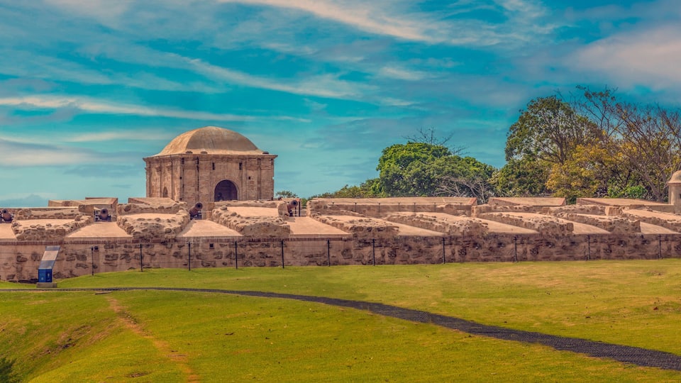 A historic stone fortress with a central dome and surrounding walls.