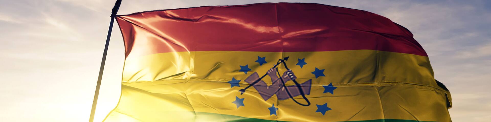 Guna de Wargandi comarca of Panama flag waving on the top sunrise mist fog