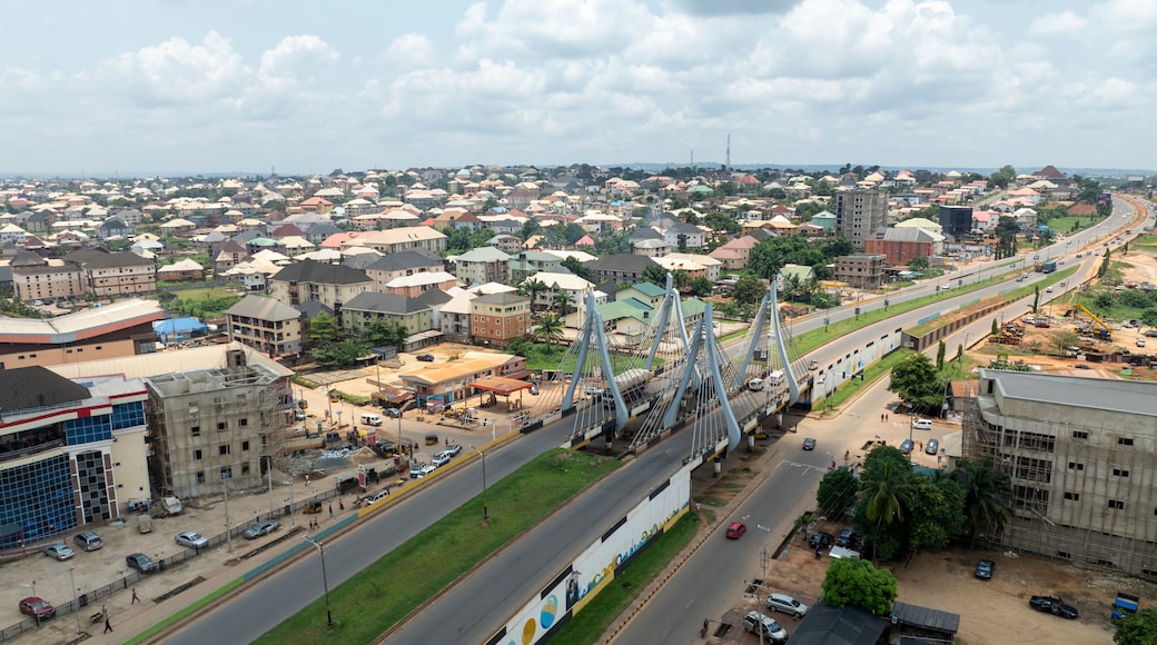 Aerial view of amawbia bridge with urban landscape and residential homes, awka south, nigeria.