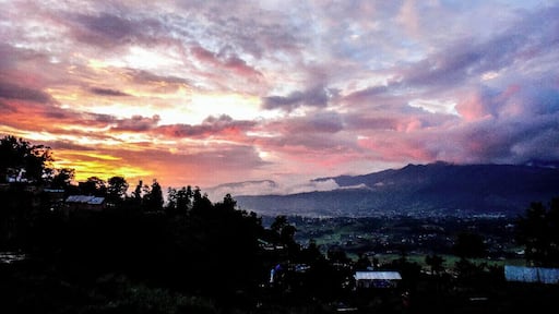 After visiting Bhaktapur, we took a bus up to see the ancient Hindu Vishnu temple Changu Narayan before it closed. It is considered to be the oldest temple in Nepal with pieces dating back to 325 A.D.
We were lucky because it had just been storming hours before but we managed to see this sunset. This overlooks the Changu village.
Warning: there seems to be a "tourist price" for these buses. We found out where everyone is charged 15-20 RPS we were charged 50. They do this because you can't understand any better. The difference in US dollars is only cents haha but still, I hate that feeling of being ripped off =S