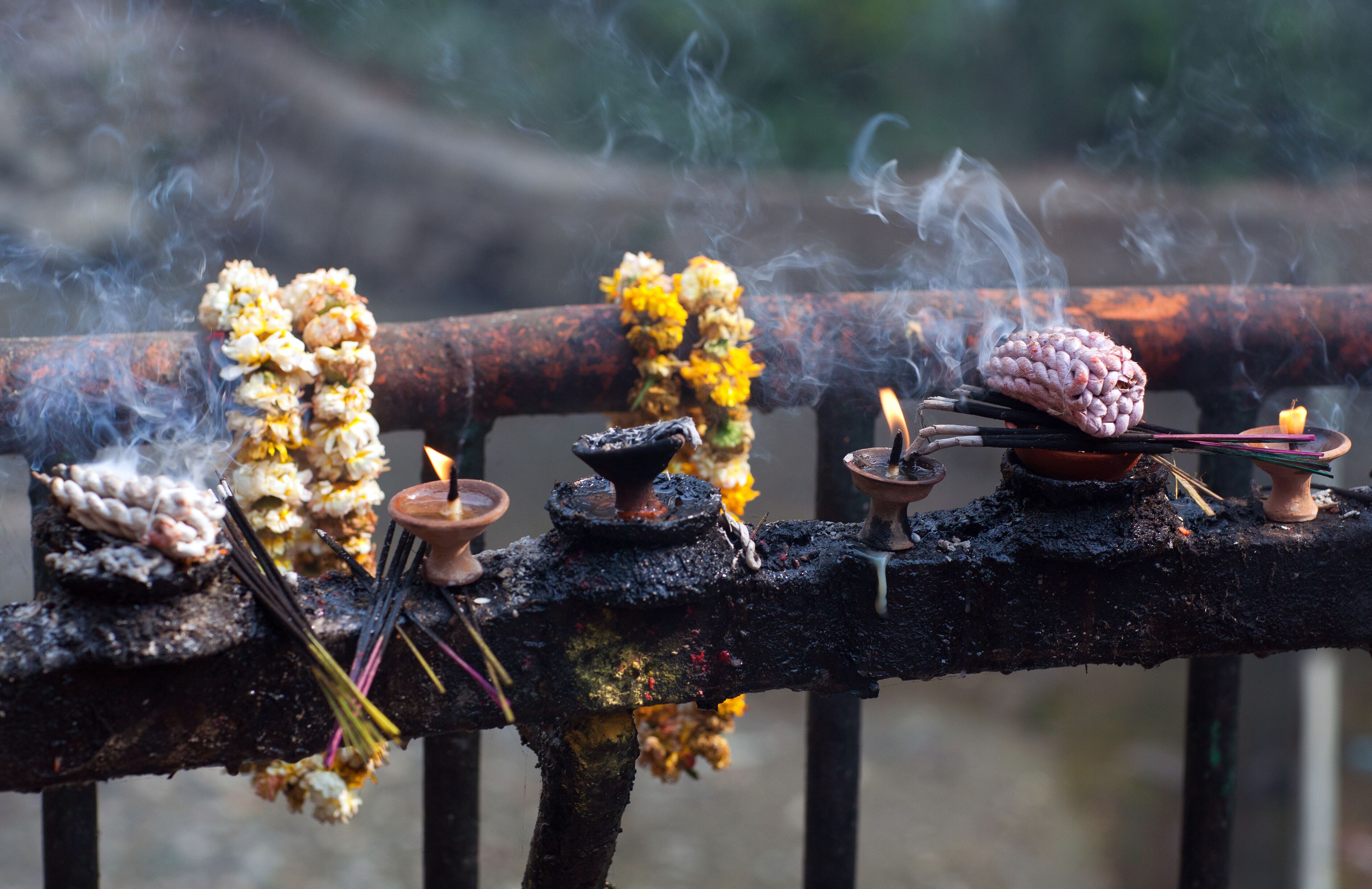 Offering candles and flowers in Dakshinkali Temple in Pharping, Nepal