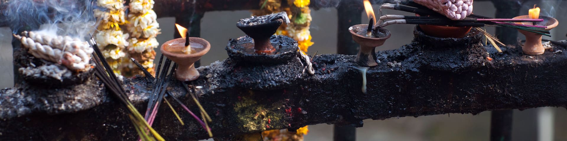 Offering candles and flowers in Dakshinkali Temple in Pharping, Nepal