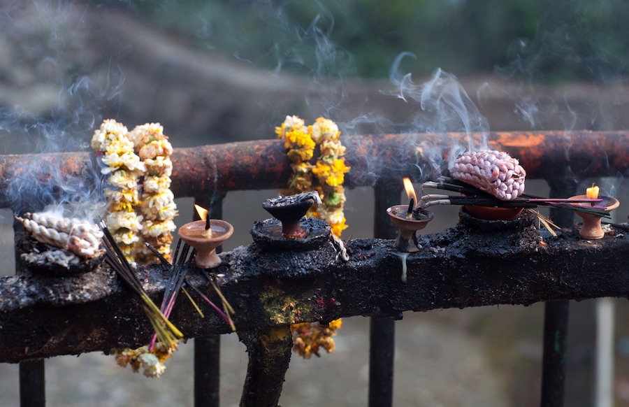 Offering candles and flowers in Dakshinkali Temple in Pharping, Nepal