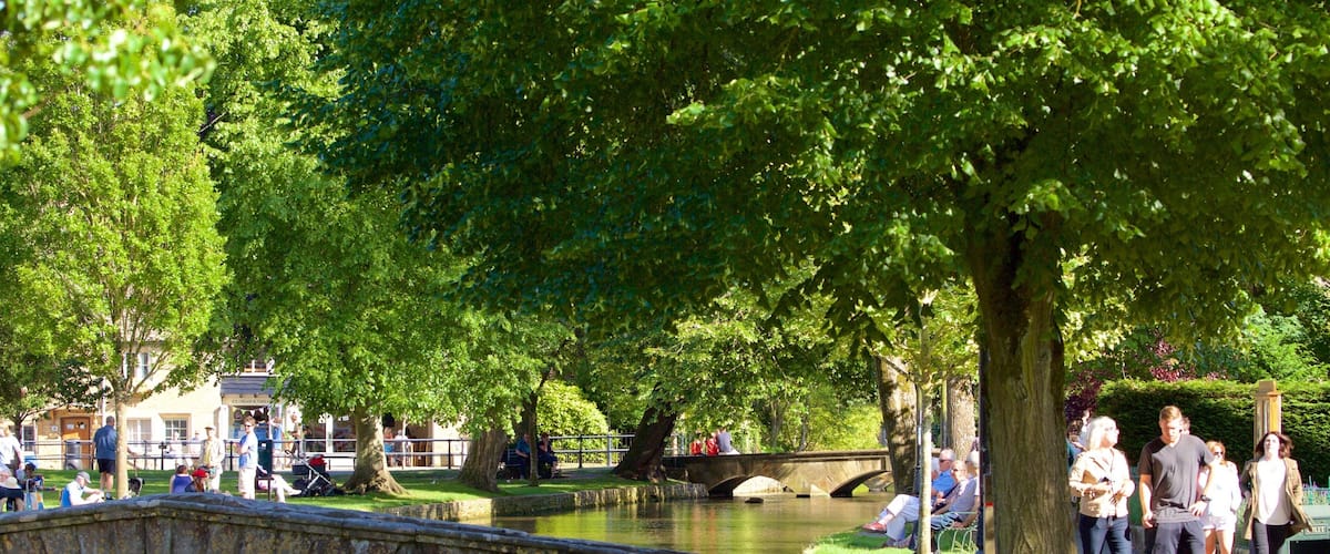 Bourton-on-Water featuring a bridge, a river or creek and a garden