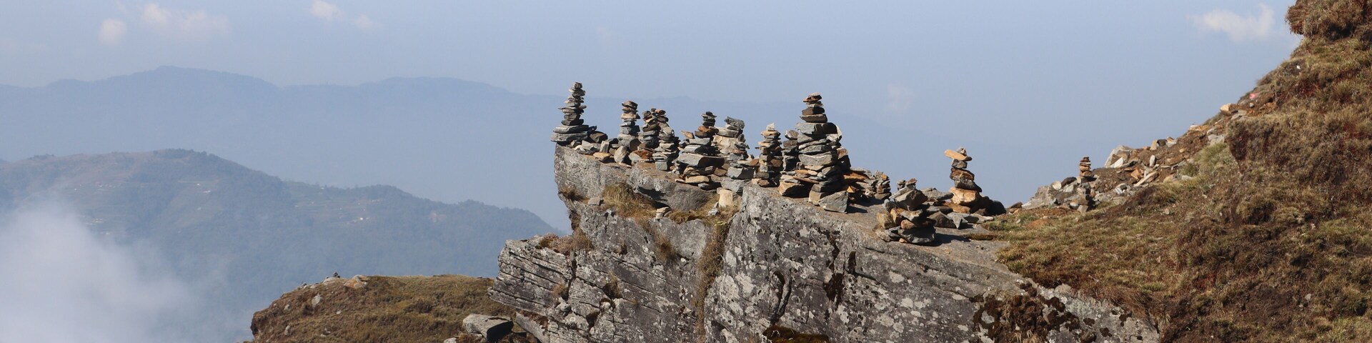 Stacked Stones.In Tinjure, Terhathum, Nepal, locals have stacked stones on a steep rock to grant their wishes.