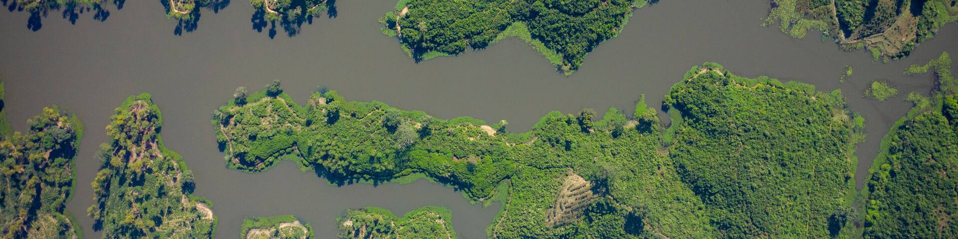 Aerial view of Madhabpur Lake from top, view of the beautiful landscape with forest around the lake, Kamalganj, Sylhet, Bangladesh.