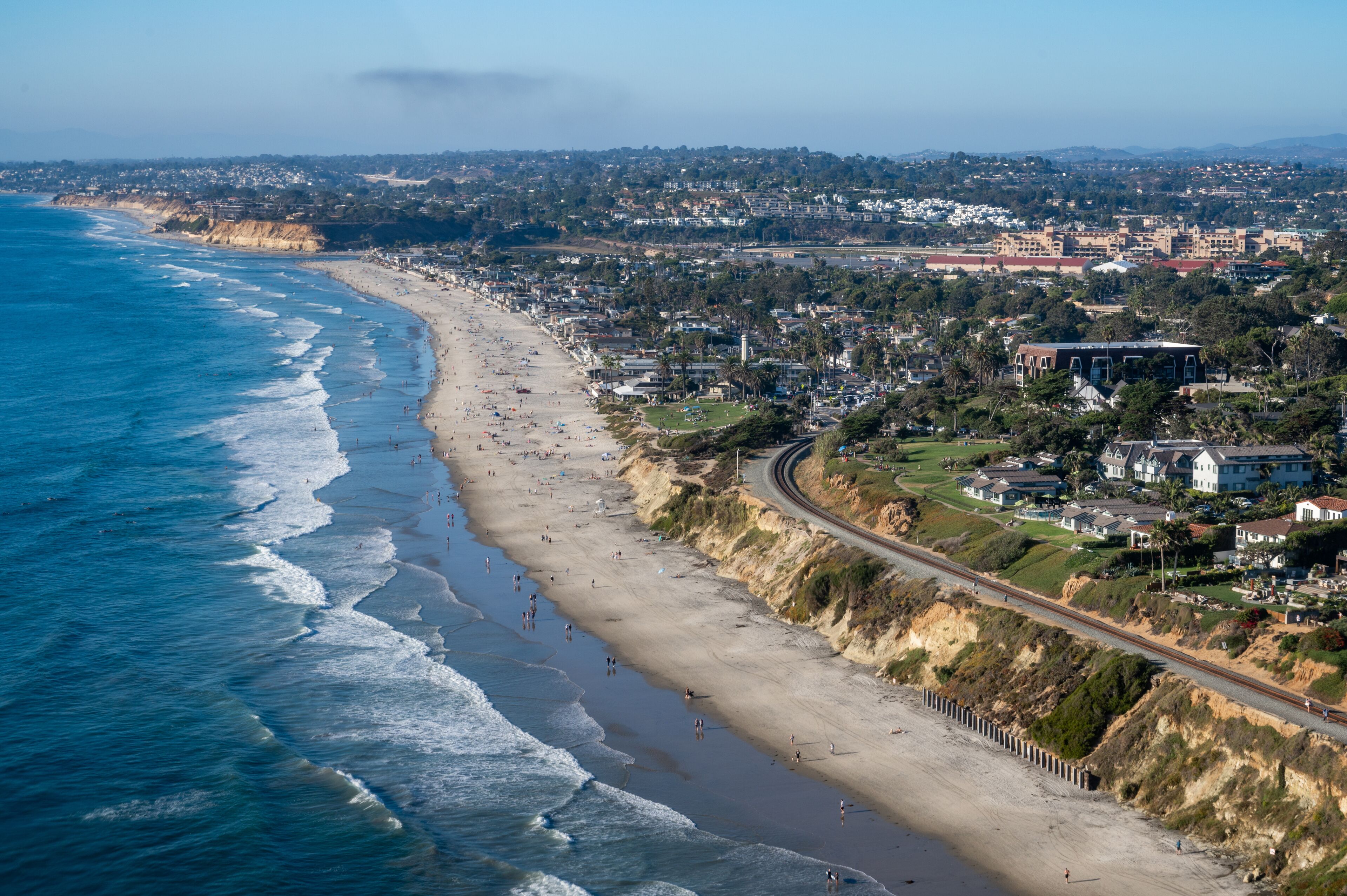 Aerial view Powerhouse park, train tracks, and coastline in San Diego California along the Del Mar bluffs