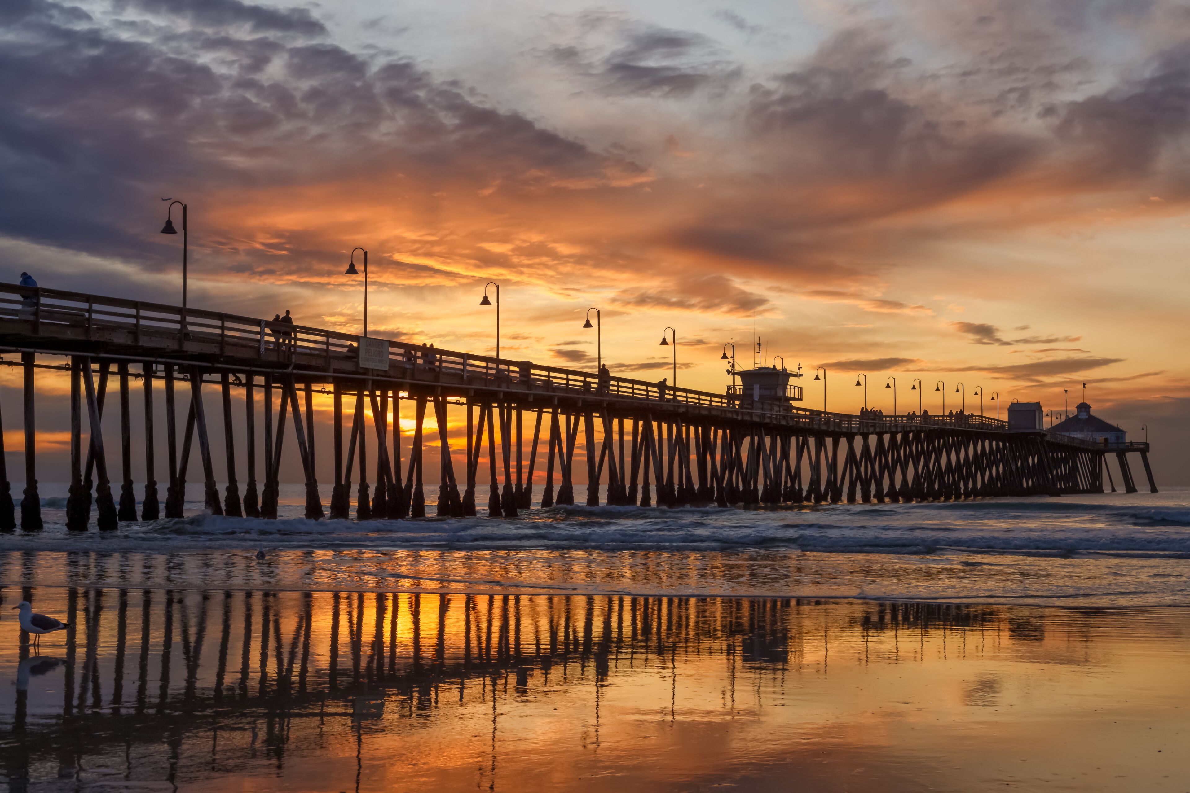 Brilliant sunset over a wooden beach pier. Imperial Beach, California, United states of America