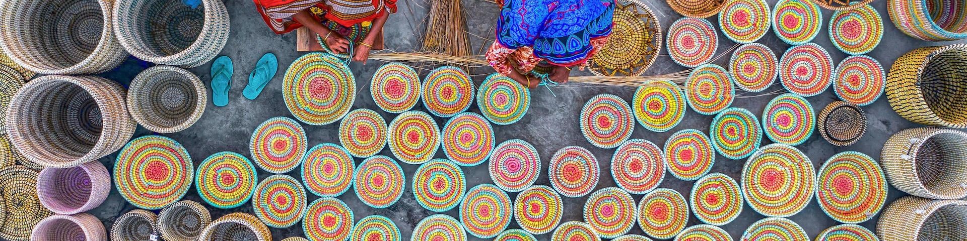 Aerial view of colorful artisans making traditional handicrafts with woven baskets, Sherpur, Bogura District, Rajshahi, Bangladesh.