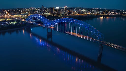 JULY 6, 2023 - MEMPHIS, TN, USA - Hernando De Soto Bridge LIGHT SHOW - Memphis, Tennessee over Mississippi River at night