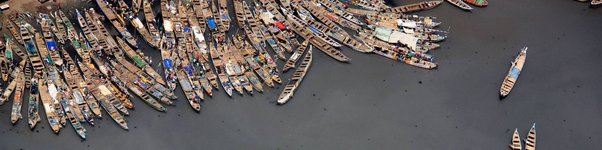Aerial view of fishing boats moored together in the port of Tema, Greater Accra, Ghana