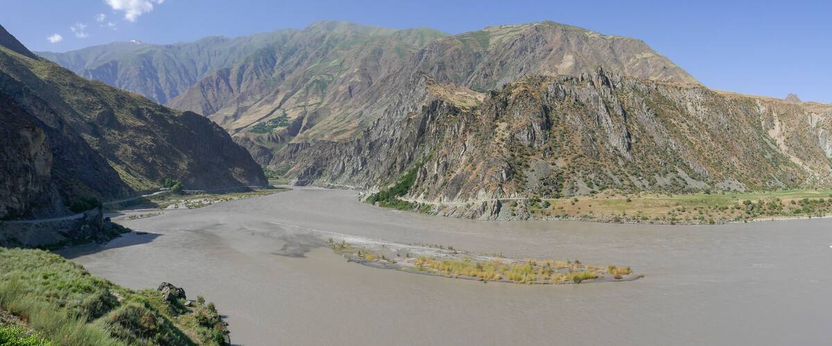 Spectacular panoramic view of the Panj river valley in Darvaz district, Gorno-Badakshan, the Pamir mountain region of Tajikistan with sandbank