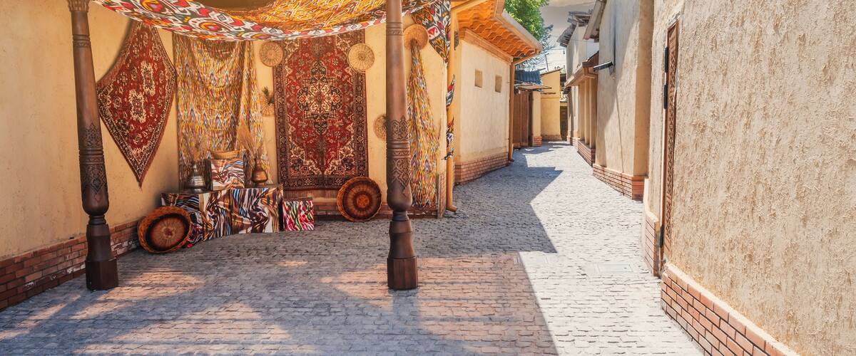 view of a narrow street with the architecture of an ancient Arab city on a sunny summer day