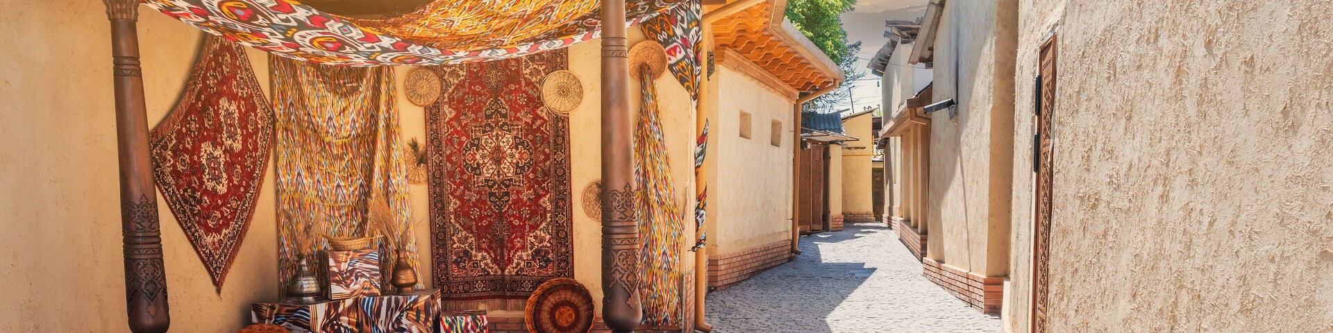 view of a narrow street with the architecture of an ancient Arab city on a sunny summer day